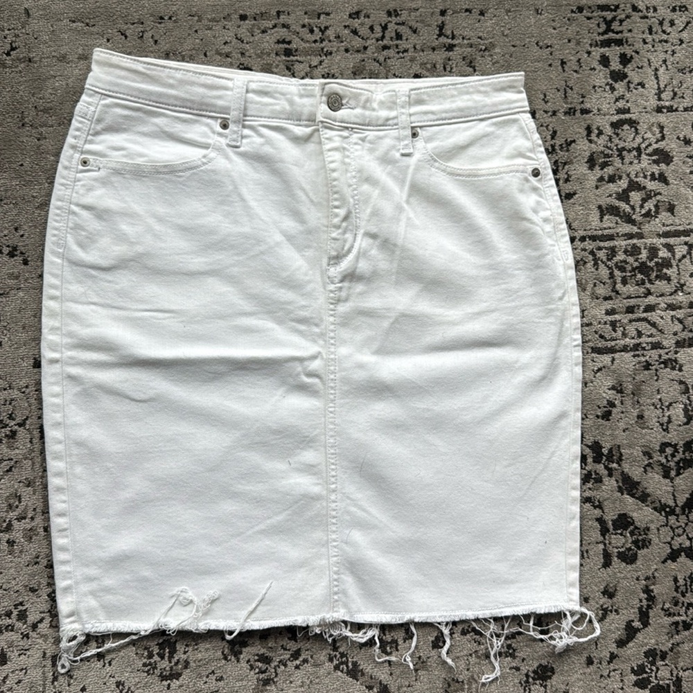 White denim skirt, size 12 (small stain!)